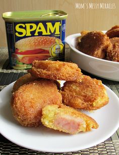 some fried food on a white plate next to a can of spam