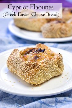 two white plates topped with baked goods on top of a blue table cloth