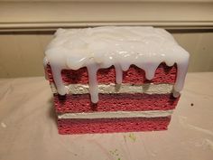 a piece of cake with white icing on it