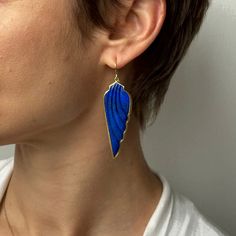 Celestial lapis wings unfurl in Sam Woehrmann's signature structural settings, taking flight in their place on the ear.

22k, 18k yellow gold 
Lapis 3/4" x 2 1/16"
Earrings hang 2 5/8" from the ear 
Each earring weighs 8.8g Wing Earrings, Beach Walk, Ear Jewelry