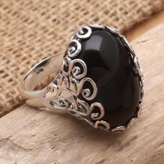 Wear Komang Wijayana's striking ring on its own to make a statement. The Balinese artisan uses a large onyx gemstone to center the ring using delicate sterling silver coils to hold the ring in a decorative bezel setting. Licorice Candy, Onyx Colour, Dragon Earrings, Onyx Gemstone, Balinese, Simple Earrings, Jewelry Packaging, Coils, Licorice