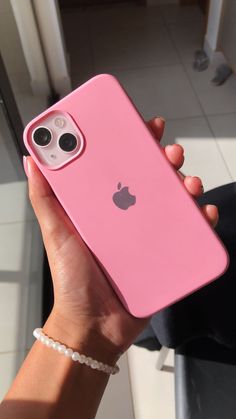 a person holding up an iphone case in their hand, with the camera on it's side