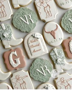 decorated cookies are arranged in the shape of baby's first year names and birth dates