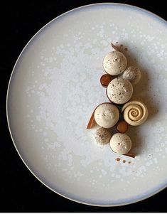 a white plate topped with different types of pastries