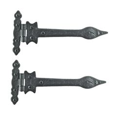 two black iron door handles on a white background