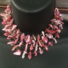 A red, pink and white shell nugget beaded necklace which is adjustable, handmade in Japan,circa 1950s. Measures 16 in long, adjustable to 13 in and is 3 in. wide. all sales final. Beaded with gold rocaille beadsinbetween shells. Ceramic Beads Necklace, Pink Sea, Chocker Necklace, Vintage Japan, Brocade Fabric, Coral Beads, Shell Beads, Shell Necklaces, Ceramic Beads