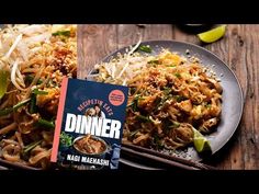 a plate full of food next to a book