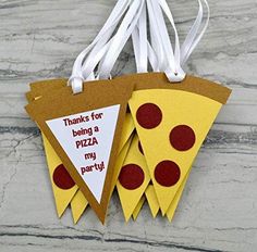 two slices of pizza hanging from strings on a marble counter top with the words thanks for being a pizza party