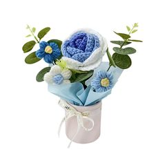 a crocheted flower arrangement in a vase with blue and white flowers on it