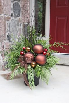 a potted plant with christmas ornaments in it