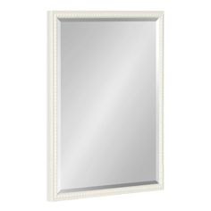 a white framed mirror with beading around the edges