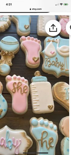 baby shower cookies are arranged on a table