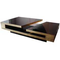 an elegant coffee table with black and gold accents