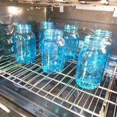 there are many blue glass bottles in the oven