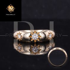 two gold rings with diamonds are on display in front of a black background and an image of the same ring