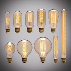 an assortment of light bulbs on a gray background