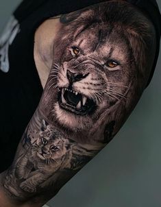 a man with a lion and tiger tattoo on his arm