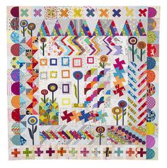 a colorful quilt with many different designs on it