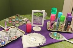 the table is set up with all kinds of makeup and other items to be used