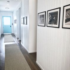 the hallway is clean and ready to be used as a place for pictures or photographs