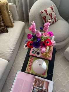 a table with flowers and books on it