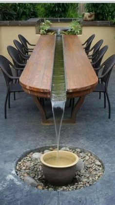 a wooden table with water coming out of it