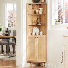 a wooden cabinet with plates and cups on it