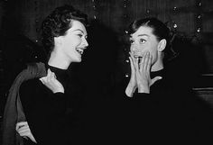 black and white photograph of two women laughing