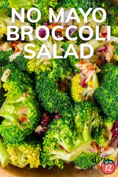 broccoli salad with cranberries and almonds in a bowl on a wooden table