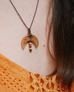 A handmade halfmoon necklace. The pendant is made of local birch wood. A piece of nature for you. Each piece of wood is unique. Therefore, the shape of your delivered necklace may differ slightly from the product images.  After sawing the tree slices, the wood is finely sanded and drilled. I burn the design into the wood by hand and treat it with a natural oil mixture. The oil protects the pendant from external influences and keeps it looking beautiful for a long time. Still, you should take off Handmade Moon Shaped Nature-inspired Necklace, Bohemian Half Moon Necklace With Moon Phase, Bohemian Half Moon Phase Necklace, Handmade Bohemian Half Moon Necklace, Bohemian Crescent Necklace For Festivals, Handmade Crescent Bohemian Necklace, Handmade Moon-shaped Bohemian Necklace, Handmade Bohemian Moon Necklace, Bohemian Natural Wood Necklaces As Gift