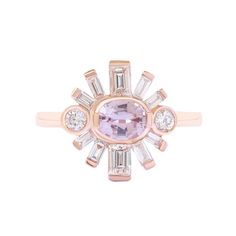 a pink diamond ring with three baguettes in the center and two diamonds on each side