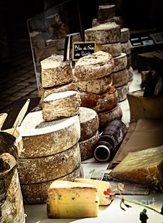 several different types of cheese stacked on top of each other