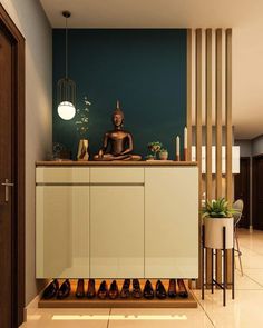 a buddha statue sitting on top of a counter