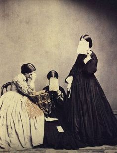 an old fashion photo of three women in dresses