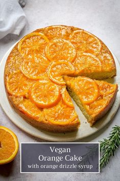 a vegan orange cake with orange drizzle syrup on top and sliced up