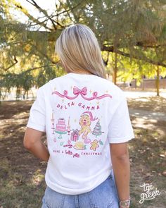 the back of a woman's white shirt with an image of a lion on it