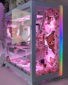 a computer case with teddy bears and flowers on it's sides, in front of a window