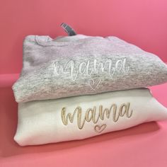 "Custom Embroidered Mama Sweatshirt for Mom with Name on Sleeve, Personalized Gift for Mom with Name On Sleeve, Embroidered Sweater for Mama Introducing our one-of-a-kind custom mama embroidered sweatshirt! Embroidered to perfection, this stylish sweatshirt is the perfect addition to any mama's wardrobe. The machine-embroidered neckline adds a touch of elegance to this already unique piece, while the custom sleeve embroidery details make it truly one-of-a-kind. Crafted with care and attention to detail, this custom embroidered sweatshirt is made to last. With high-quality materials and expert craftsmanship, it's sure to become a favorite piece in your wardrobe for years to come. So why wait? Add some personality to your wardrobe and order your custom embroidered sweatshirt today! GROUP ORD Embroidered White Tops For Mother's Day, Custom Embroidered White Tops For Mother's Day, Mama Gifts, Embroidered Sweater, Personalized Gifts For Mom, Embroidered Neckline, Mama Sweatshirt, Pregnancy Reveals, Embroidery Details