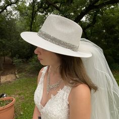 White Bridal Wedding Fedora Hat with Hat Band of Crushed Rhinestones. 36 Inch Two Layed Veil Accented with a Beautiful Rhinestone Bow This is a perfect Hat and Veil for a Church, Garden, Casual or Formal Wedding. This Accessory would complement any Bride and Her Wedding. One size fits most with a soft elastic band inside hat. Elegant White Hat With Rhinestones, Elegant Flat Brim Fedora For Wedding, Elegant Wedding Fedora With Flat Brim, Adjustable Fedora For Wedding And Kentucky Derby, Wedding Fedora Fascinator For Kentucky Derby, Fitted Fedora Wedding Hat, Wedding Fascinator For Kentucky Derby In Fedora Shape, Flat Brim Fedora For Wedding At Kentucky Derby, Elegant Short Brim Fedora For Wedding