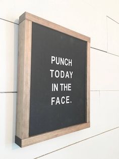 a black and white sign that says punch today in the face