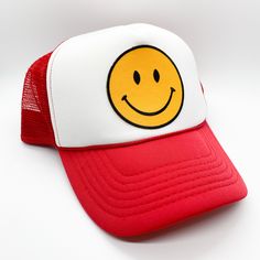 Keep it trendy with this new smiley face patch trucker hat! A best-seller, these hats are adjustable and can fit just about any head. They're super comfortable too. The smiley face patch is sure to keep you smiling all day long! Casual Smiley Face Snapback Baseball Cap, Adjustable Baseball Cap With Smiley Face, Casual Smiley Face Snapback Hat, Trendy Smiley Face Baseball Cap With Curved Brim, Trendy Smiley Face Hat With Curved Brim, Trendy Curved Brim Hat With Smiley Face, Adjustable Smiley Face Cap, Trendy Smiley Face Cap, Trendy Summer Baseball Cap With Smiley Face