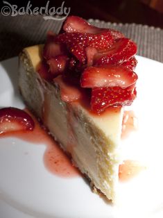 a piece of cheesecake with strawberries on top