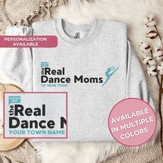 the real dance moms t - shirt is on display next to some cotton flowers