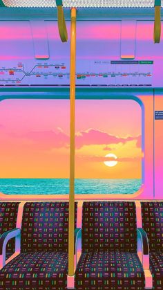 the sun is setting over the ocean as seen from an empty seat on a train