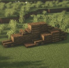 a wooden structure in the middle of a field