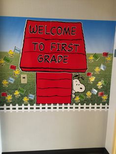 a welcome to first grade painted on the wall