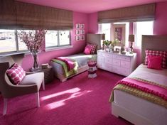 a bedroom with pink carpet and two beds