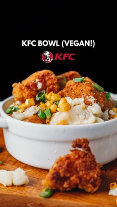 a white bowl filled with food on top of a wooden cutting board