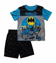 Batman Fearless PJs for Boys. Great gift for any boy that loves Batman. A determined Batman is ready to battle his enemies. Bat Signal and Gotham City in the background. Shorts are black with a Batman mask and small blue bat signal print throughout. Of a cozy and breathable polyester fabric.   Paypal Payments Accepted.   All purchases are mailed out within 2 business days of receipt of payment. Blue Batman, Batman Mask, Short Pajamas, Batman Shirt, Super Hero Outfits, Sleep Wear, Gotham City, Baby & Toddler Clothing, Pajama Shorts