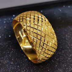 a gold ring sitting on top of a table